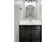 Stylish bathroom featuring modern fixtures, a sleek vanity, and an elegant mirror, creating a serene space at 7221 Messenger Dr, Willow Springs, NC 27592