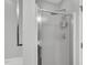 Bathroom showcasing a glass enclosed shower with chrome fixtures and white tile at 7221 Messenger Dr, Willow Springs, NC 27592
