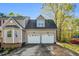 Attached two-car garage, with matching doors at 7221 Messenger Dr, Willow Springs, NC 27592