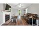 Inviting living room with fireplace and hardwood floors at 7221 Messenger Dr, Willow Springs, NC 27592