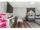 A spacious living room featuring a comfortable sofa, area, and a large window that fills the room with natural light at 7221 Messenger Dr, Willow Springs, NC 27592
