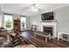 Inviting living room with fireplace, hardwood floors, and comfortable seating at 7221 Messenger Dr, Willow Springs, NC 27592