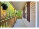 Exterior view of covered porch area and wooden railing at 7221 Messenger Dr, Willow Springs, NC 27592