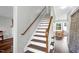 Bright stairway leading to upper level at 7221 Messenger Dr, Willow Springs, NC 27592
