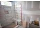 A bathroom under construction with white tiles, clips, a shower niche, a corner seat, and a window at 7436 Summer Tanager Trl, Raleigh, NC 27614