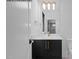 Bathroom featuring a modern vanity with a black cabinet, gold hardware, and a white countertop at 7436 Summer Tanager Trl, Raleigh, NC 27614