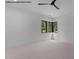 Minimalist bedroom featuring a corner window that offers ample sunlight and outdoor views at 7436 Summer Tanager Trl, Raleigh, NC 27614