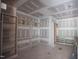 Unfinished custom closet features shelving and ample storage opportunities at 7436 Summer Tanager Trl, Raleigh, NC 27614