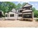 Exterior elevation showing a home with a spacious back porch and outdoor living space at 7436 Summer Tanager Trl, Raleigh, NC 27614