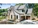 Stunning exterior with brick accents, dark trim, and attached garage at 7436 Summer Tanager Trl, Raleigh, NC 27614