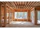 Interior view of new home construction showcasing framing and window placement at 7436 Summer Tanager Trl, Raleigh, NC 27614