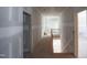 Hallway with views of the stairs and multiple rooms at 7436 Summer Tanager Trl, Raleigh, NC 27614