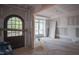 Interior view of room with an arched doorway, fresh drywall and a white door at 7436 Summer Tanager Trl, Raleigh, NC 27614