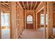Unfinished interior view of the front entrance framed by wooden studs at 7436 Summer Tanager Trl, Raleigh, NC 27614