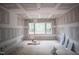 Spacious living area featuring ample natural light and large windows at 7436 Summer Tanager Trl, Raleigh, NC 27614