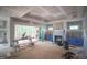 Spacious living room with fireplace featuring large sliding glass doors to the patio at 7436 Summer Tanager Trl, Raleigh, NC 27614