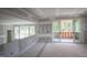 Upstairs loft area with a sliding door that leads to the outdoor balcony at 7436 Summer Tanager Trl, Raleigh, NC 27614