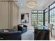Stylish home office with a large window, comfortable seating, and elegant decor at 7436 Summer Tanager Trl, Raleigh, NC 27614