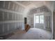 Unfinished room featuring large window allowing for ample natural light at 7436 Summer Tanager Trl, Raleigh, NC 27614