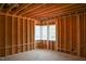 Unfinished room featuring natural light from windows showing the framing and construction phase at 7436 Summer Tanager Trl, Raleigh, NC 27614