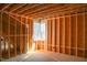 Unfinished room featuring natural light from a double window showing the framing and construction phase at 7436 Summer Tanager Trl, Raleigh, NC 27614