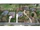 Areal shot of the community showing manicured lawns, well-maintained landscaping, and proximity to a golf course and lake at 749 Golfers Vw, Pittsboro, NC 27312