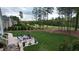 Expansive backyard featuring a patio, lawn, and golf course views at 749 Golfers Vw, Pittsboro, NC 27312
