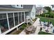Backyard oasis with outdoor dining, a screened-in porch, and a fire pit area at 749 Golfers Vw, Pittsboro, NC 27312