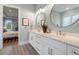 Bright bathroom featuring double vanity and views to bedroom at 749 Golfers Vw, Pittsboro, NC 27312