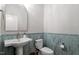 Stylish powder room featuring blue tile backsplash and contemporary sink at 749 Golfers Vw, Pittsboro, NC 27312