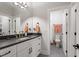 Spacious bathroom with double sink vanity, modern fixtures and a separate toilet room at 749 Golfers Vw, Pittsboro, NC 27312