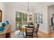 Cozy dining area with backyard views and stylish table setting at 749 Golfers Vw, Pittsboro, NC 27312