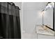 Bathroom featuring double vanity with stone countertop and a shower behind a curtain at 8059 Hogan Dr, Wake Forest, NC 27587