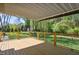 Large backyard deck with metal cable railing and covered awning at 8059 Hogan Dr, Wake Forest, NC 27587