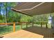 Beautiful deck with metal cable railing and awning covering at 8059 Hogan Dr, Wake Forest, NC 27587