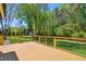 Spacious wooden deck offers a great view of the private backyard and landscaping at 8059 Hogan Dr, Wake Forest, NC 27587