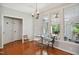 Breakfast area featuring large windows with views of the screened porch and backyard at 8059 Hogan Dr, Wake Forest, NC 27587