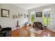 Bright home office with natural light, hardwood floors, and ample space for a desk and seating at 8059 Hogan Dr, Wake Forest, NC 27587