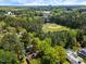 A high angle of a property with mature trees surrounding a well-maintained baseball field at 812 Northclift Dr, Raleigh, NC 27609