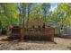Expansive backyard with a deck, ideal for outdoor entertaining, surrounded by lush greenery at 812 Northclift Dr, Raleigh, NC 27609