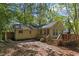 Charming home exterior with a wooden deck and a lush, wooded backyard at 812 Northclift Dr, Raleigh, NC 27609