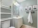 Lovely bathroom with a toilet, sink and vanity, and decorative artwork at 812 Northclift Dr, Raleigh, NC 27609