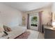 Bright bedroom featuring a window, a bed, and a dresser at 812 Northclift Dr, Raleigh, NC 27609
