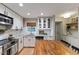 Modern kitchen featuring stainless steel appliances, granite counters, and white subway tile backsplash at 812 Northclift Dr, Raleigh, NC 27609