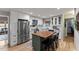 Bright kitchen featuring a butcher block island, stainless steel appliances, and white cabinetry at 812 Northclift Dr, Raleigh, NC 27609