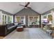 Spacious living room with vaulted ceilings, large windows, and comfortable seating area at 812 Northclift Dr, Raleigh, NC 27609