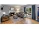 Cozy living room features a fireplace, hardwood floors, and ample natural light at 812 Northclift Dr, Raleigh, NC 27609