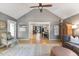 Open-concept living room with wood floors, bright natural light, and a clear sight line to the dining area at 812 Northclift Dr, Raleigh, NC 27609