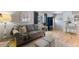 Comfortable living room with a gray sofa, hardwood floors, and stylish decor at 812 Northclift Dr, Raleigh, NC 27609