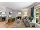 Cozy living room features a fireplace, hardwood floors, and ample natural light at 812 Northclift Dr, Raleigh, NC 27609